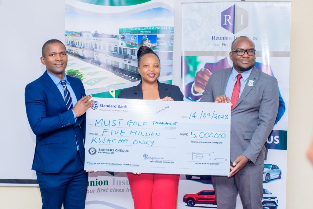 In the picture are Technical Manager Kapesa and Ntaba (right) handing over a dummuy cheque to MUST Registrar Alfred Manombo (centre)