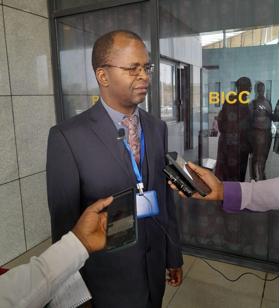 Mndolo speaking to media after opening the conference