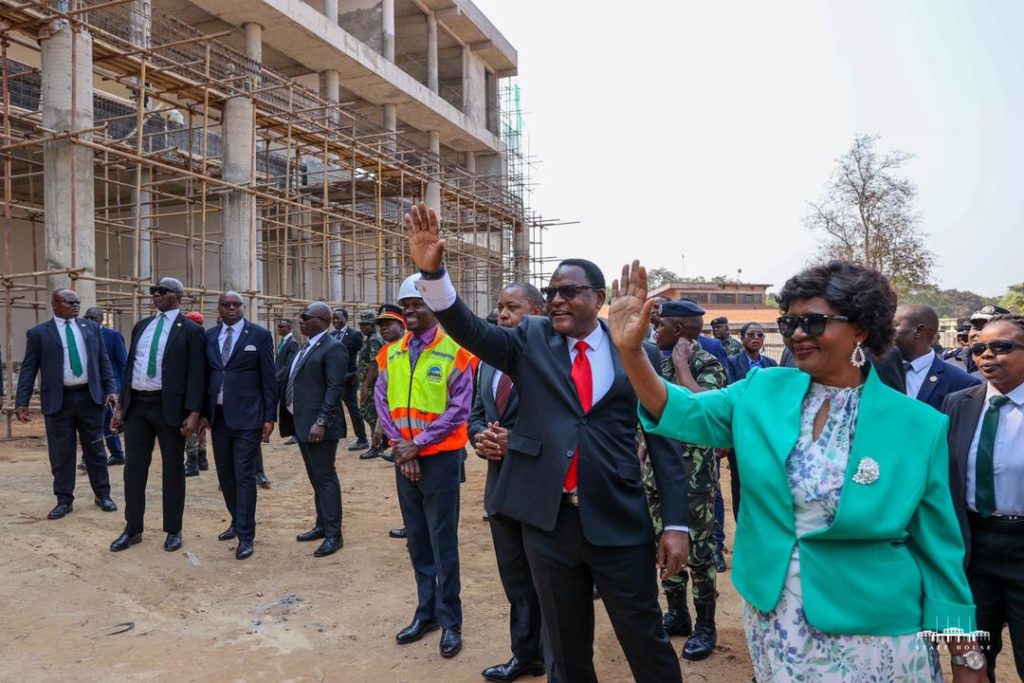 President Chakwera and First Lady Madam Monica Chakwera waving students after inspecting the library construction work