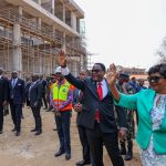 President Chakwera and First Lady Madam Monica Chakwera waving students after inspecting the library construction work