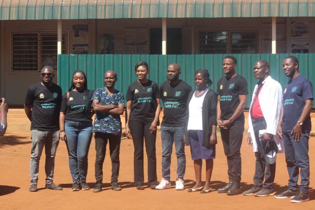 Alumni of the GHC pose for a photo after the screening services