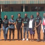 Alumni of the GHC pose for a photo after the screening services