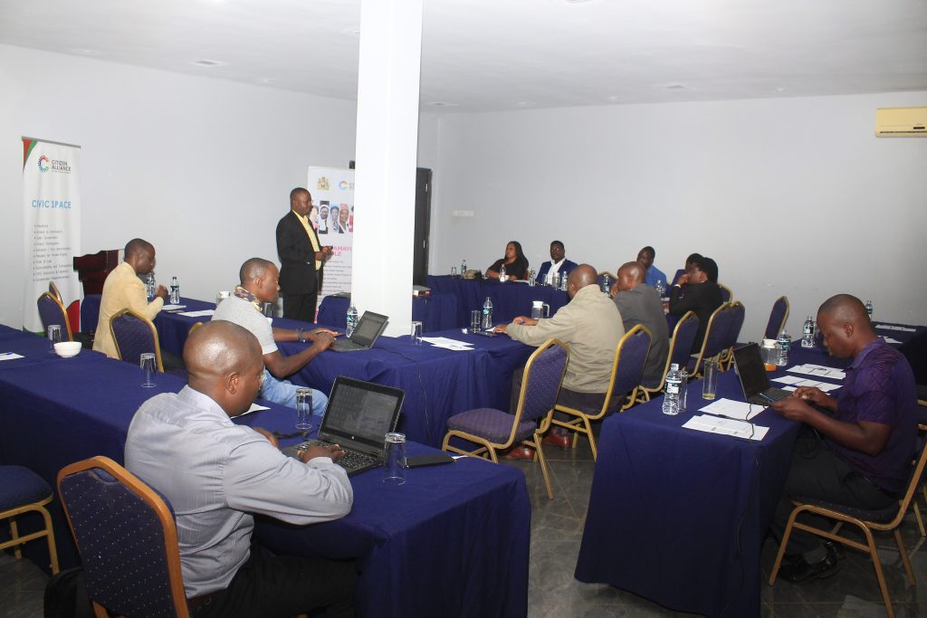 CSOs strategize on how to avert voter apathy, violence in 2025 elections 1 Nkhoma standing in front addressing participants to the sectoral engagement meeting in Lilongwe