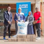 M'bweza and CPL Human Resourcers Manager, Titus Mtonyo, handing over the donation to Sister Linda Viano and her fellow nun