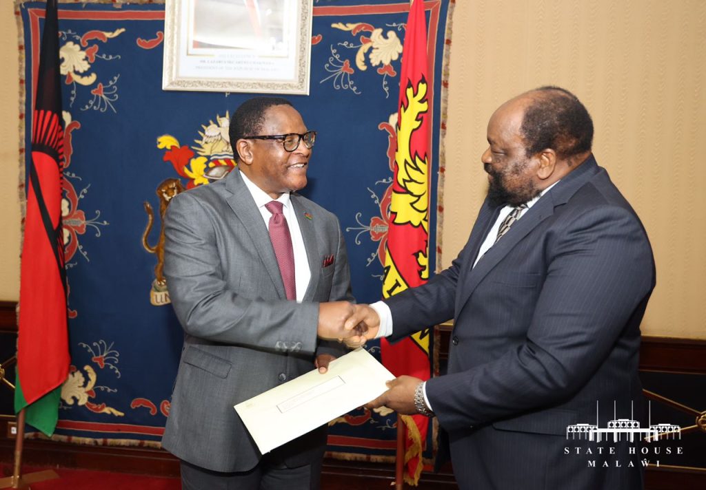 President Chakwera (left) shakes Simbarashe Mumbengegwi after the meeting