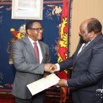 President Chakwera (left) shakes Simbarashe Mumbengegwi after the meeting