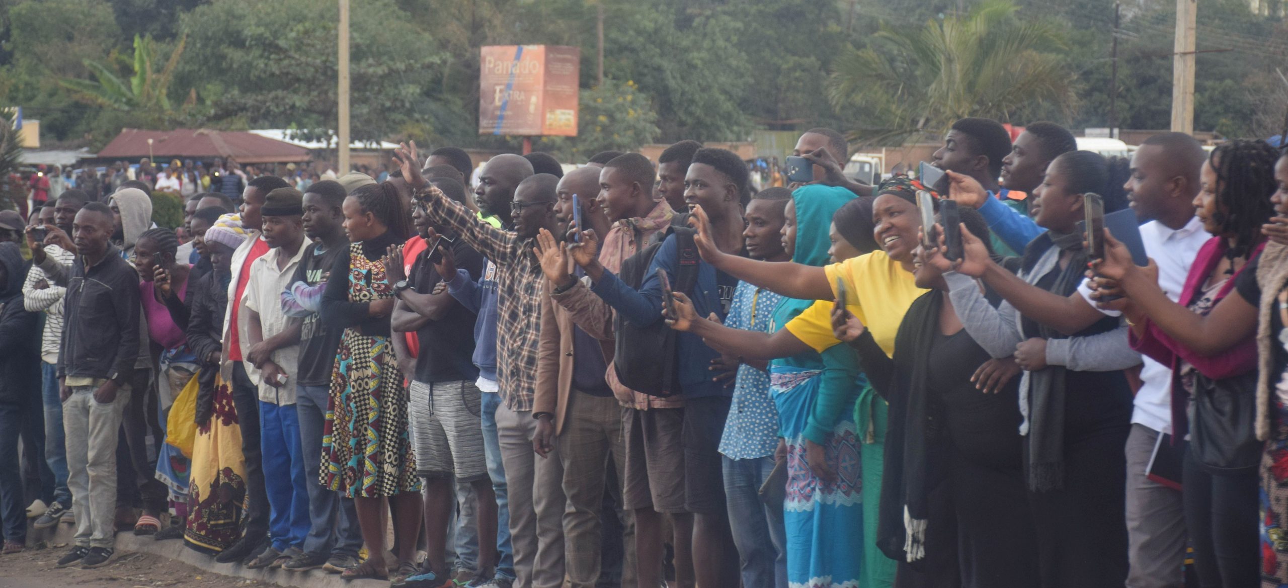 Residents waving at the passing Convoy pic by Arkangel Tembo Mana scaled