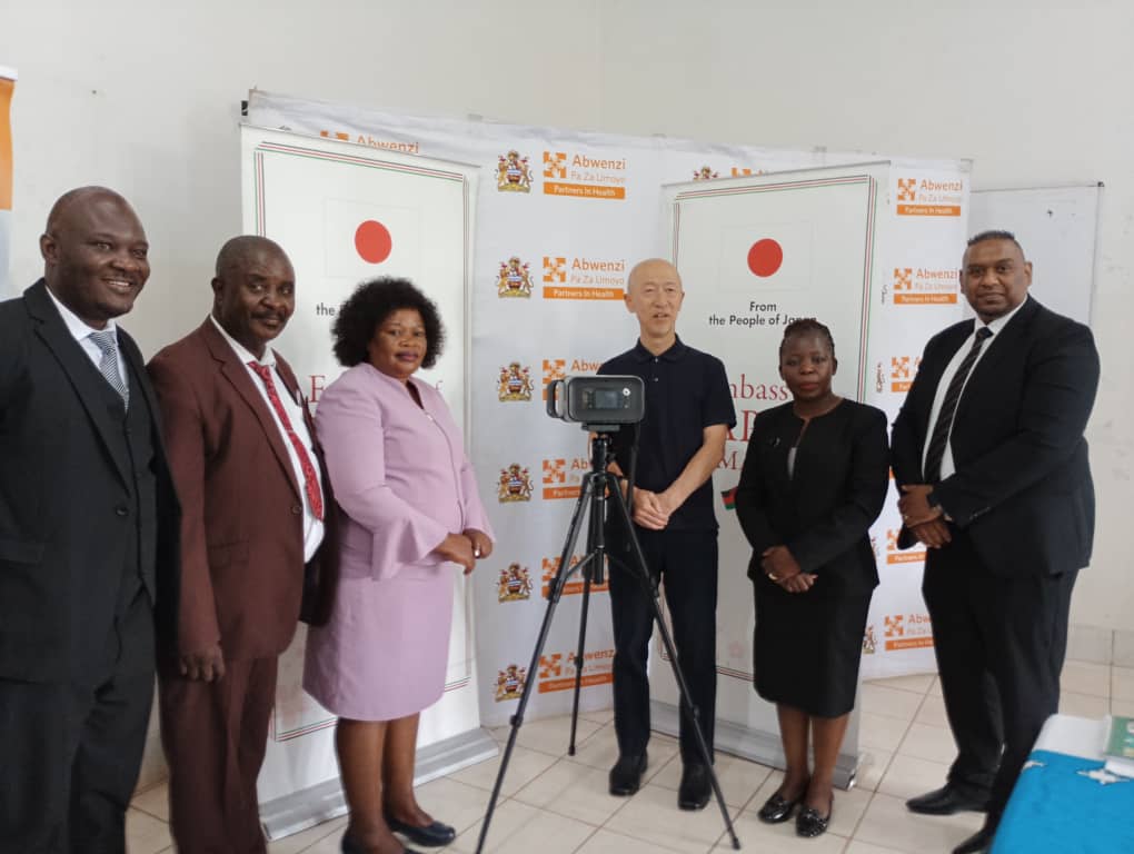 Japanese Embassy donates portable X-ray machine to Neno DHO 2 officials pose with the donated equipment