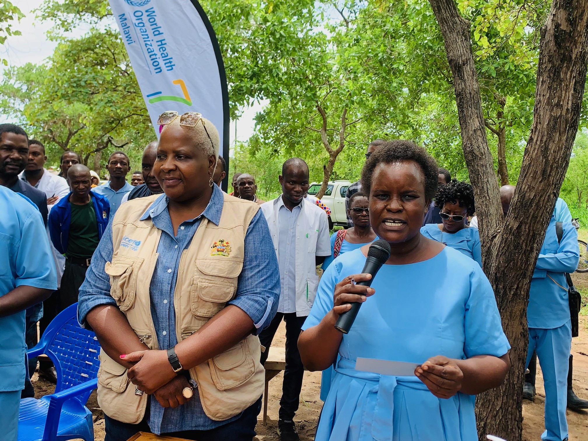 Chiponda Left listerns to an HSA talk on the vaccine right during the launch