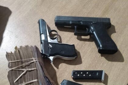 The revovered money and pistols Nkhata Bay