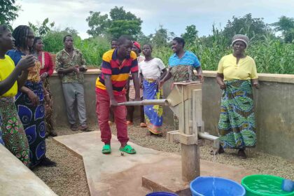 VH Chiyambeni drawing water from the borehole constructed with funding from USAID through Titukulane Activity Photos by Watipaso Mzungu