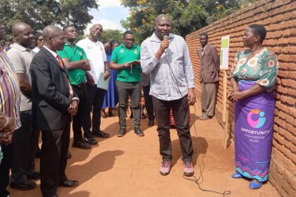 Chambo Second right chatting with farmers cedep