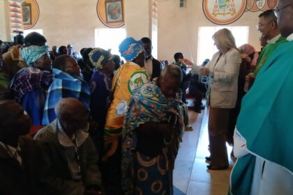 Father Sikwese joins other priests and a team from the Catholic Secretariat in presenting gifts to grandparents and the elderly persons in Dedza